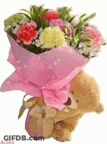 A Teddy Bear Is Holding A Bouquet Of Flowers In A Pink Bag . GIF