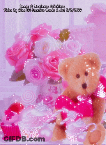 A Teddy Bear Is Holding A Candy Cane In Front Of A Bouquet Of Pink Roses And Cupcakes GIF
