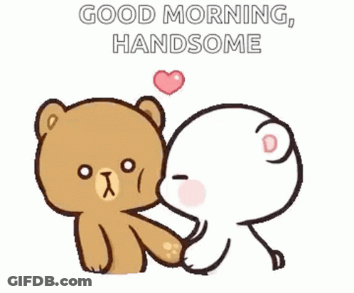 A Teddy Bear Is Kissing Another Teddy Bear On The Cheek . GIF