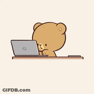 A Teddy Bear Is Laying On A Pillow Looking At A Cell Phone . GIF
