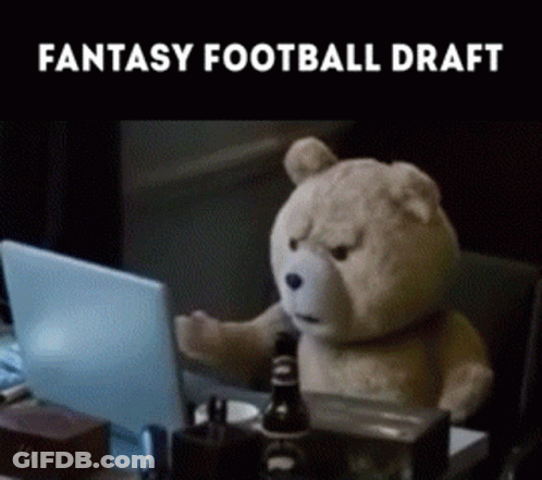 A Teddy Bear Is Sitting At A Desk With A Laptop And The Words Fantasy Football Draft On The Bottom GIF