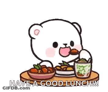 A Teddy Bear Is Sitting At A Table Eating A Meal . GIF