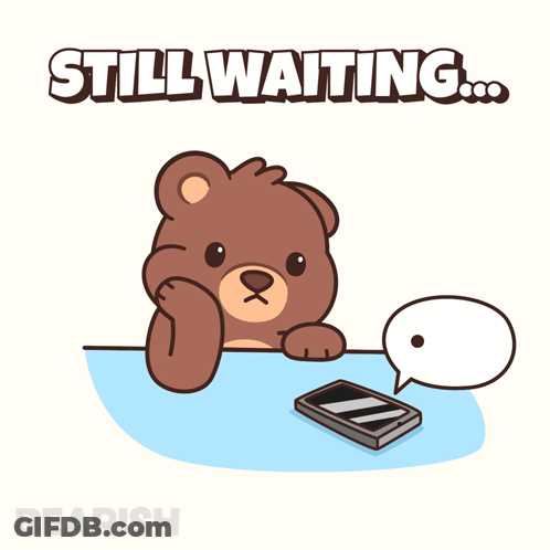 A Teddy Bear Is Sitting At A Table With A Cell Phone And A Speech Bubble That Reads Still Waiting GIF