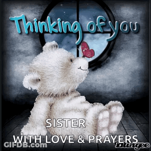 A Teddy Bear Is Sitting In Front Of A Window With The Words " Thinking Of You Sister With Love & Prayers " Below It GIF