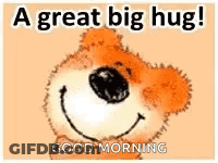 A Teddy Bear Is Smiling And Saying `` A Great Big Hug ! `` Good Morning . GIF
