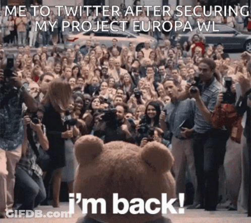 A Teddy Bear Is Standing In Front Of A Crowd Of People And Says " I 'M Back " GIF