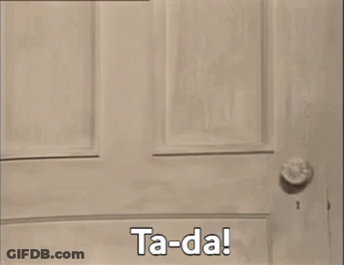 A Teddy Bear Is Standing In Front Of A Window And Says Ta-Da ! GIF