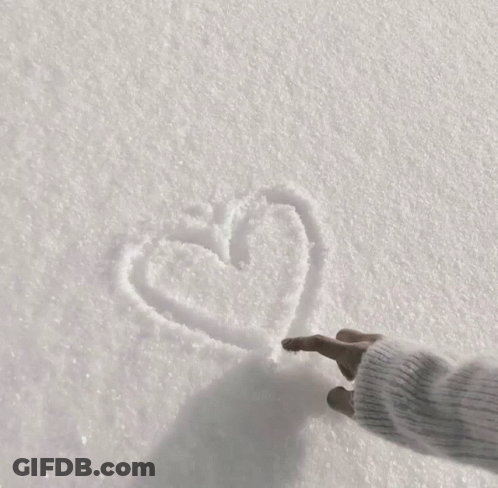 A Teddy Bear Made Out Of Snow Is Sitting On The Ground GIF