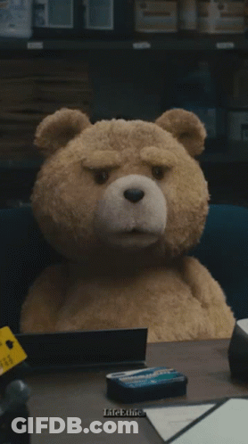 A Teddy Bear Sits At A Desk With The Words You Got A Lot Of Problems GIF