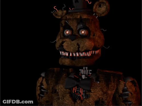 A Teddy Bear With Glowing Eyes And Sharp Teeth Is In The Dark GIF