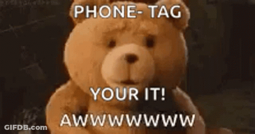 A Teddy Bear With The Words Phone Tag Your It Written On It GIF
