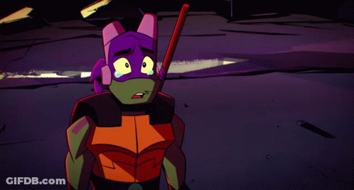 A Teenage Mutant Ninja Turtle Is Holding A Stick In His Hand GIF