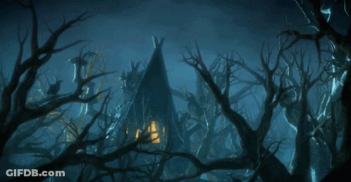 A Teepee In The Middle Of A Dark Forest With Trees Without Leaves GIF