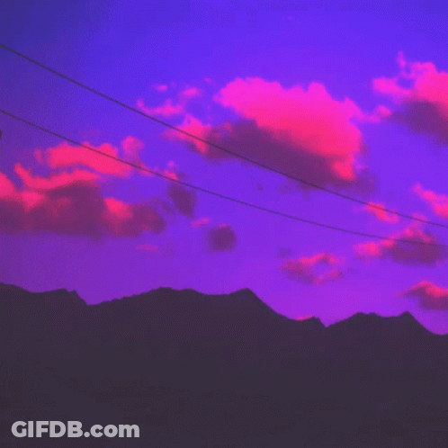 A Telephone Pole With A Purple Sky In The Background GIF