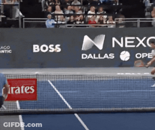 A Tennis Court With A Banner That Says Boss Dallas On It GIF