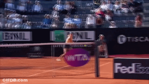 A Tennis Court With A Fedex Advertisement In The Foreground GIF