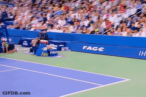 A Tennis Court With A Sign That Says Fage GIF
