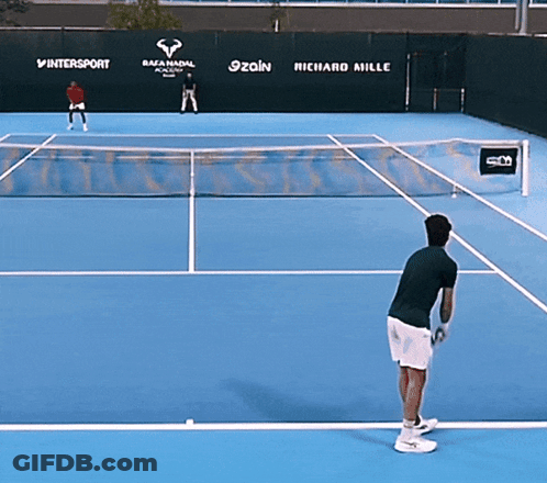 A Tennis Court With Advertisements For Richard Mille And Intersport In The Background GIF