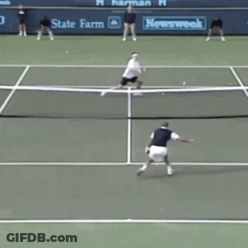 A Tennis Game Is Being Played On A Court With A State Farm Banner Behind The Net GIF