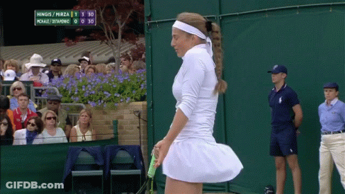 A Tennis Match Between Hingis And Mirza Is Being Watched By A Crowd GIF
