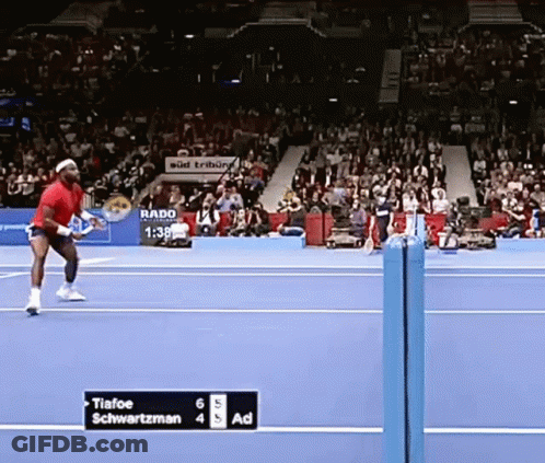 A Tennis Match Between Tiafoe And Schwartzman Is In Progress GIF