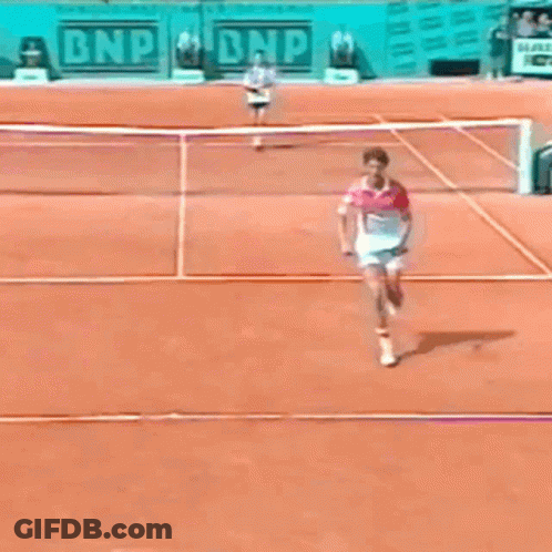 A Tennis Match Is Being Played In Front Of A Bnp Sign GIF