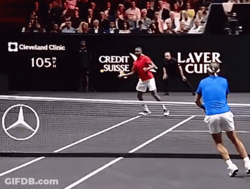 A Tennis Match Is Being Played In Front Of A Large Screen That Says Cleveland Clinic GIF