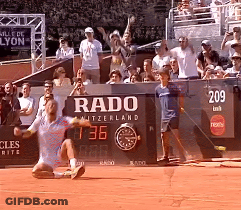 A Tennis Match Is Being Played In Front Of A Rado Sign GIF