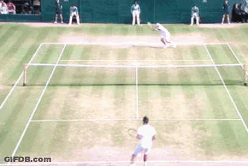 A Tennis Match Is Being Played On A Court GIF