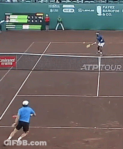 A Tennis Match Is Being Played On A Court With Emirates Airlines Advertisements On The Wall GIF