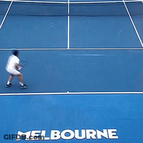 A Tennis Player Is Falling On A Court With The Word Melbourne On It GIF
