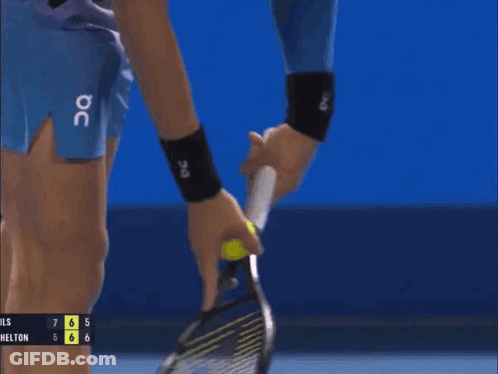 A Tennis Player Is Holding A Tennis Racquet In Front Of A Scoreboard That Says Hills 7 6 5 6 6 GIF