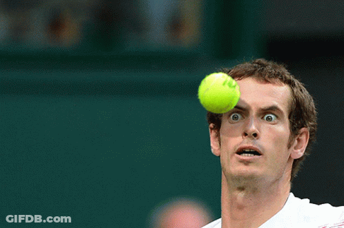 A Tennis Player Looks Up At A Tennis Ball With The Letter O On It GIF