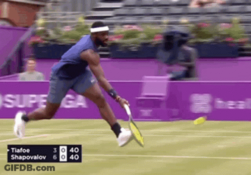 A Tennis Player Named Tiafoo Shapovalov Is Swinging His Racket GIF