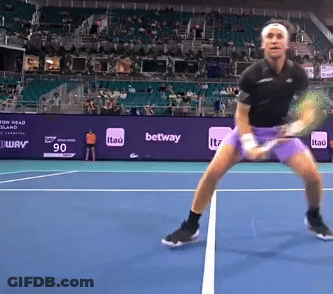 A Tennis Player On A Court With A Banner That Says ' Itau ' On It GIF
