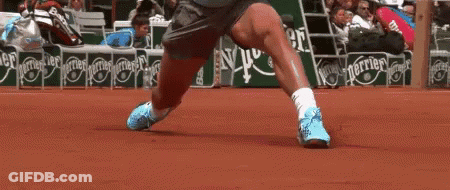 A Tennis Player 'S Legs Are Shown In Front Of A Perrier Advertisement GIF