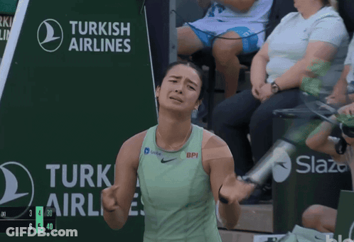 A Tennis Player Stands In Front Of A Turkish Airlines Sign GIF
