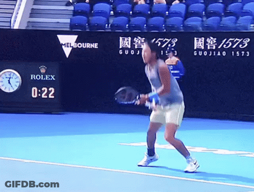 A Tennis Player Stands On A Court With A Rolex Sign In The Background GIF