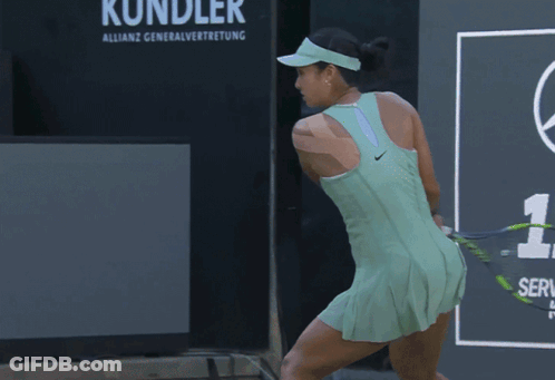 A Tennis Player Wearing A Green Tank Top With Bpi Written On It GIF