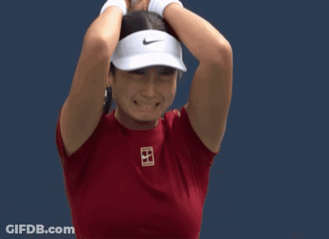 A Tennis Player Wearing A Red Shirt With The Letter B On The Front GIF