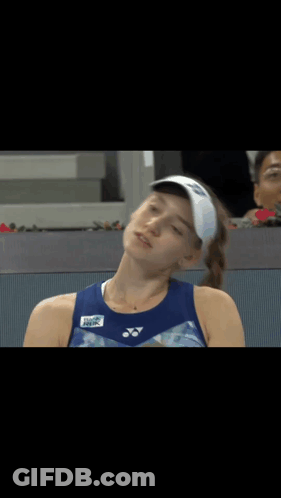 A Tennis Player Wearing A Yonex Visor Looks At Something GIF