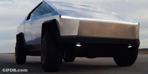 A Tesla Cybertruck Is Parked In The Desert GIF