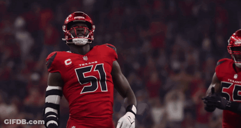 A Texans Football Player Wearing Number 51 Stands Next To Another Player Wearing Number 55 GIF