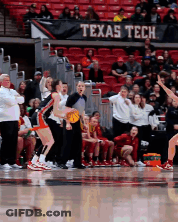 A Texas Tech Banner Hangs Over A Basketball Court GIF