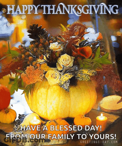 A Thanksgiving Card With A Pumpkin Filled With Flowers And Candles . GIF