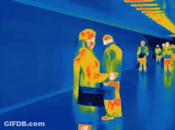 A Thermal Image Of People Walking In A Hallway With A Blue Background GIF