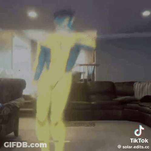 A Tiktok Video Of A Person Dancing In A Living Room With A Couch In The Background GIF