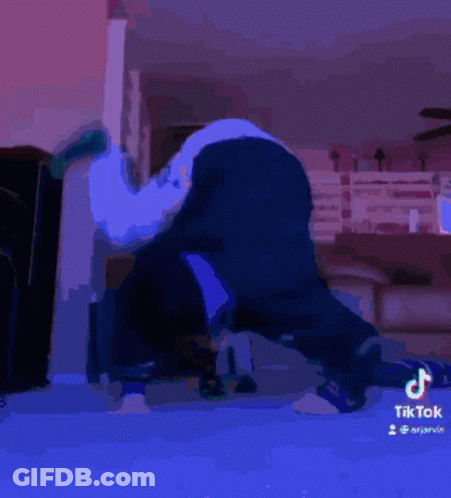 A Tiktok Video Of A Person Laying On Their Back With A Green Sock On GIF