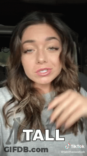 A Tiktok Video Of A Woman With The Word Tall On It GIF