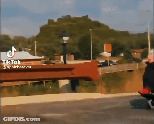 A Tiktok Video Shows A Person Riding A Bike On A Bridge GIF